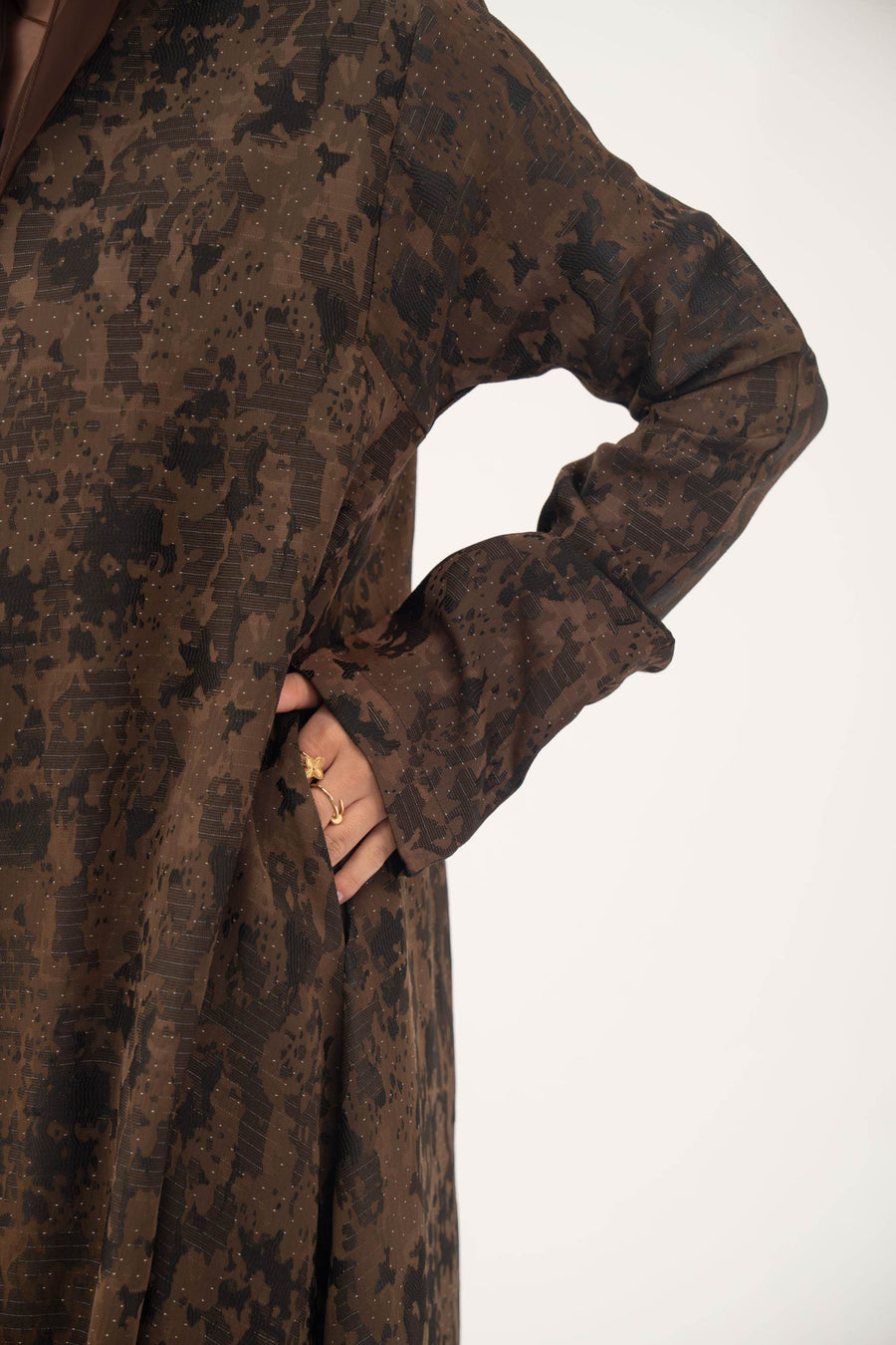 Espresso brown lightweight jacquard silk abaya with subtle textured weave, open front, side pockets, and full-length sleeves.