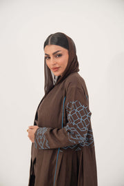 Mocha brown lightweight linen-blend abaya with sky-blue embroidery and batwing sleeves featuring blue piping and light-blue cuff details.