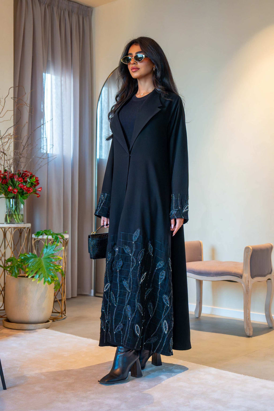 Elegant black crepe abaya with delicate leaf embroidery on cuffs and hem, featuring a lightweight fabric for comfortable all-day wear - Night Leaf
