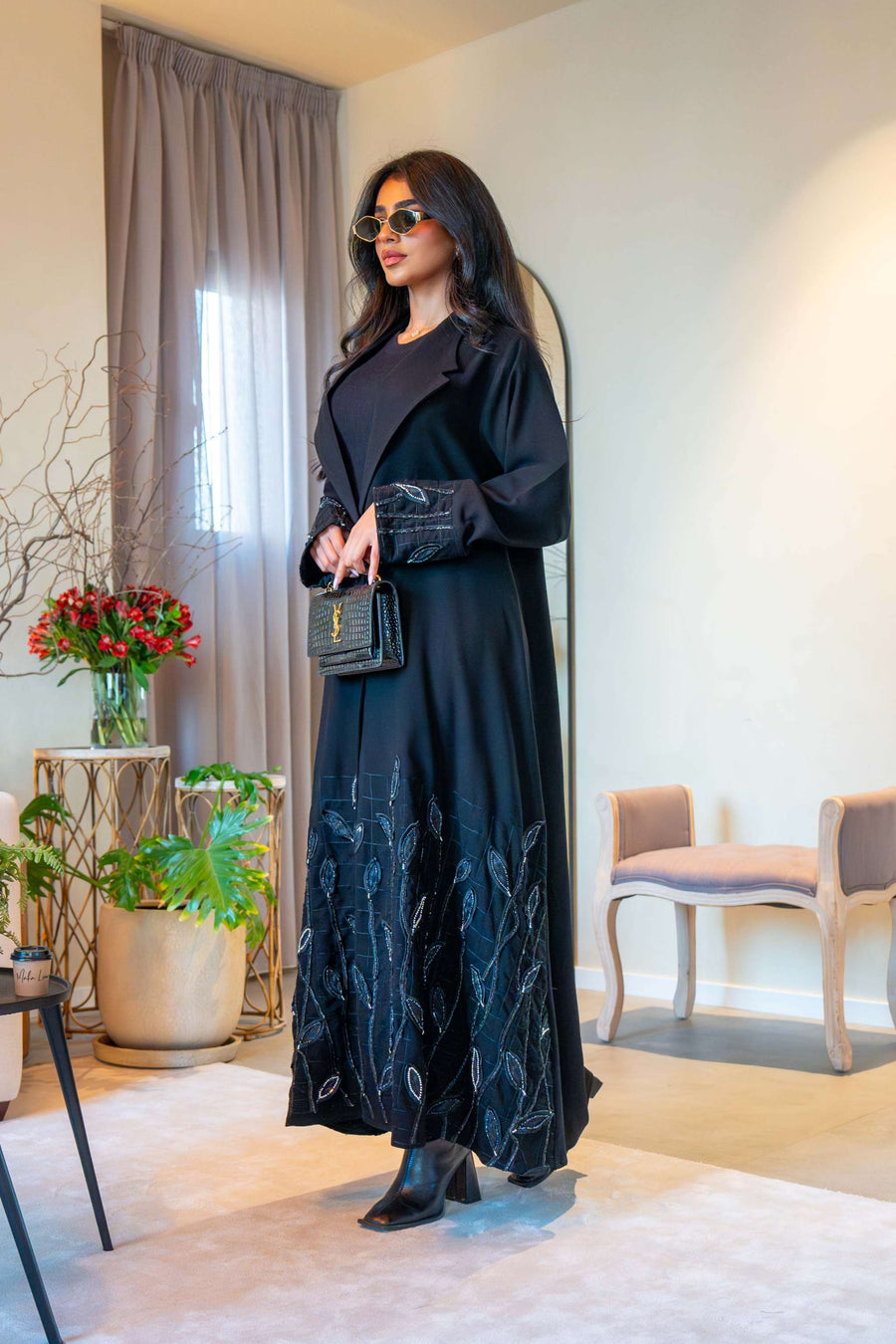 Elegant black crepe abaya with delicate leaf embroidery on cuffs and hem, featuring a lightweight fabric for comfortable all-day wear - Night Leaf