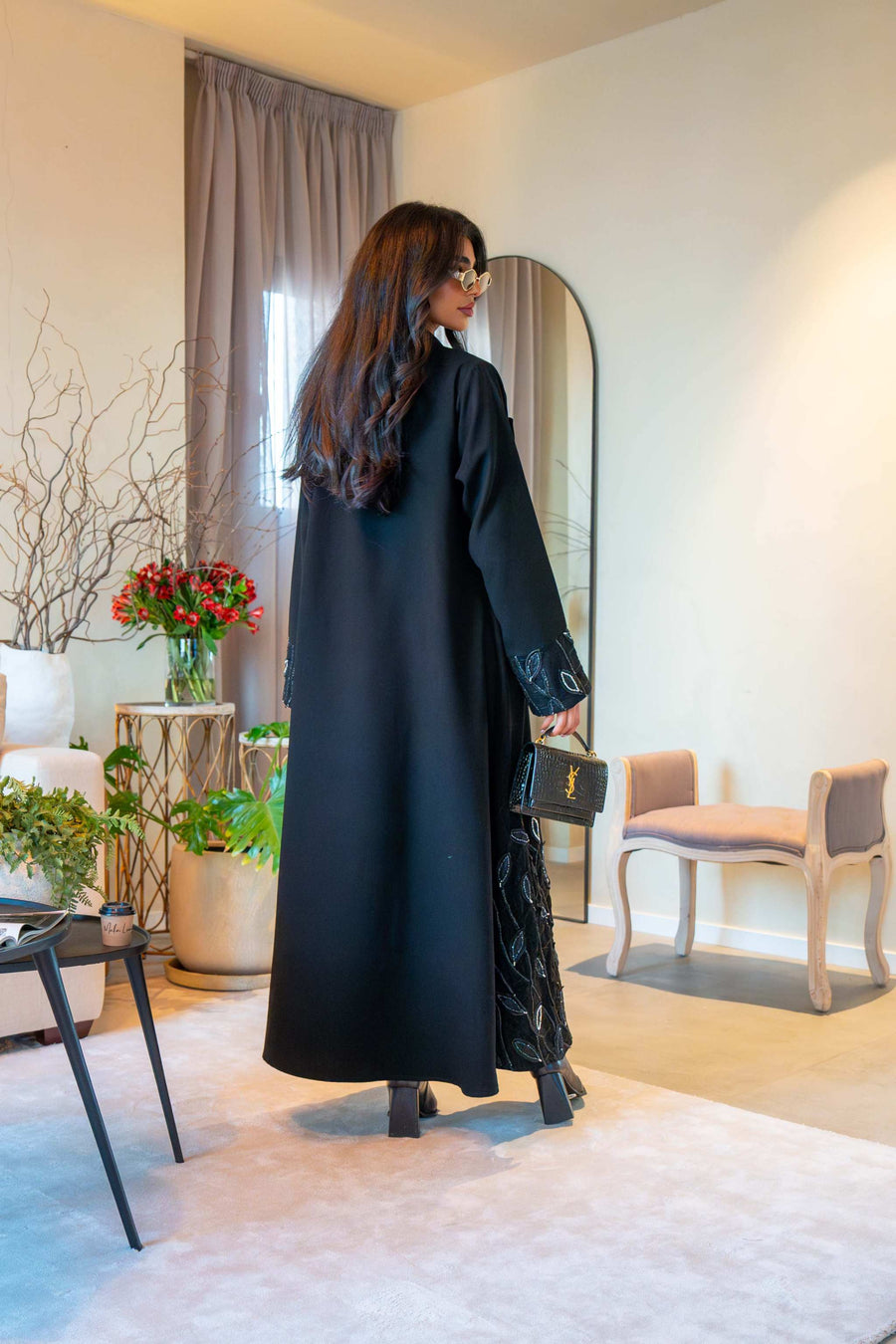 Elegant black crepe abaya with delicate leaf embroidery on cuffs and hem, featuring a lightweight fabric for comfortable all-day wear - Night Leaf