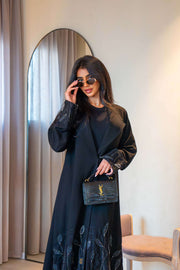 Elegant black crepe abaya with delicate leaf embroidery on cuffs and hem, featuring a lightweight fabric for comfortable all-day wear - Night Leaf