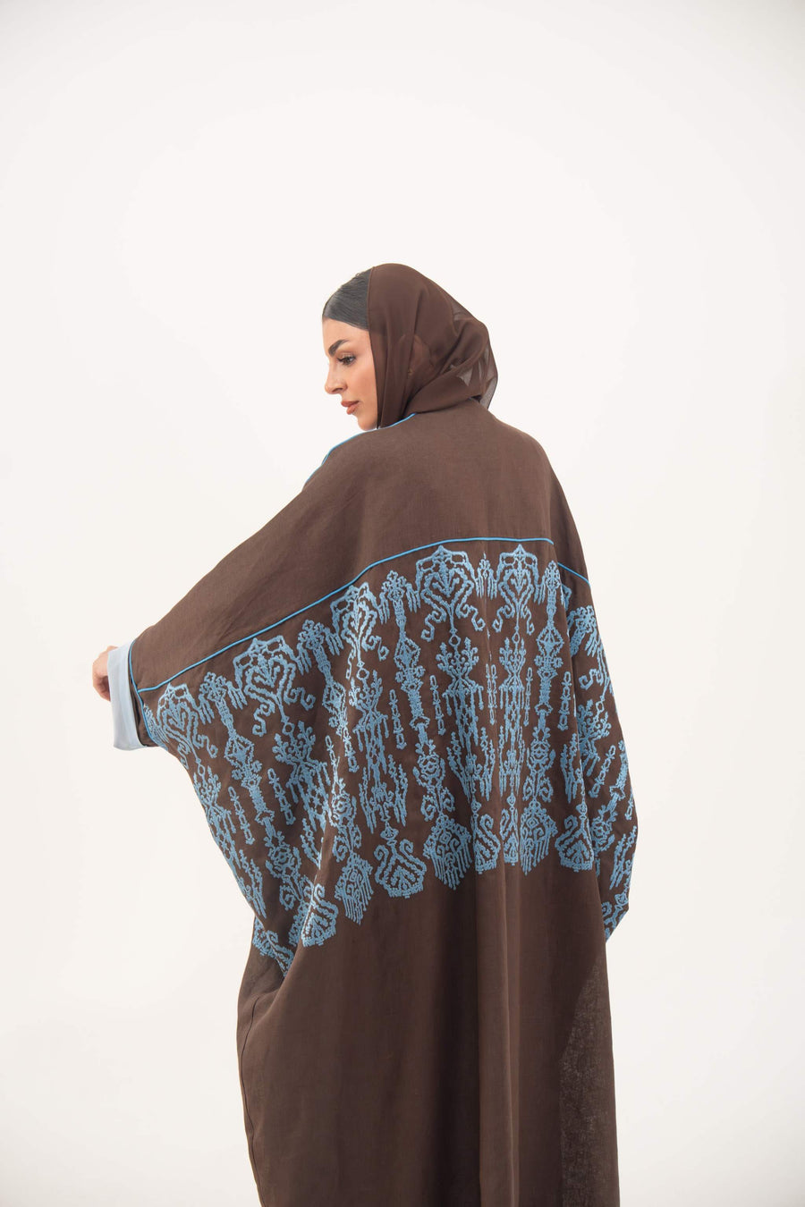 Brown linen bisht abaya with blue shak embroidery and light blue piping on sleeves and shoulders