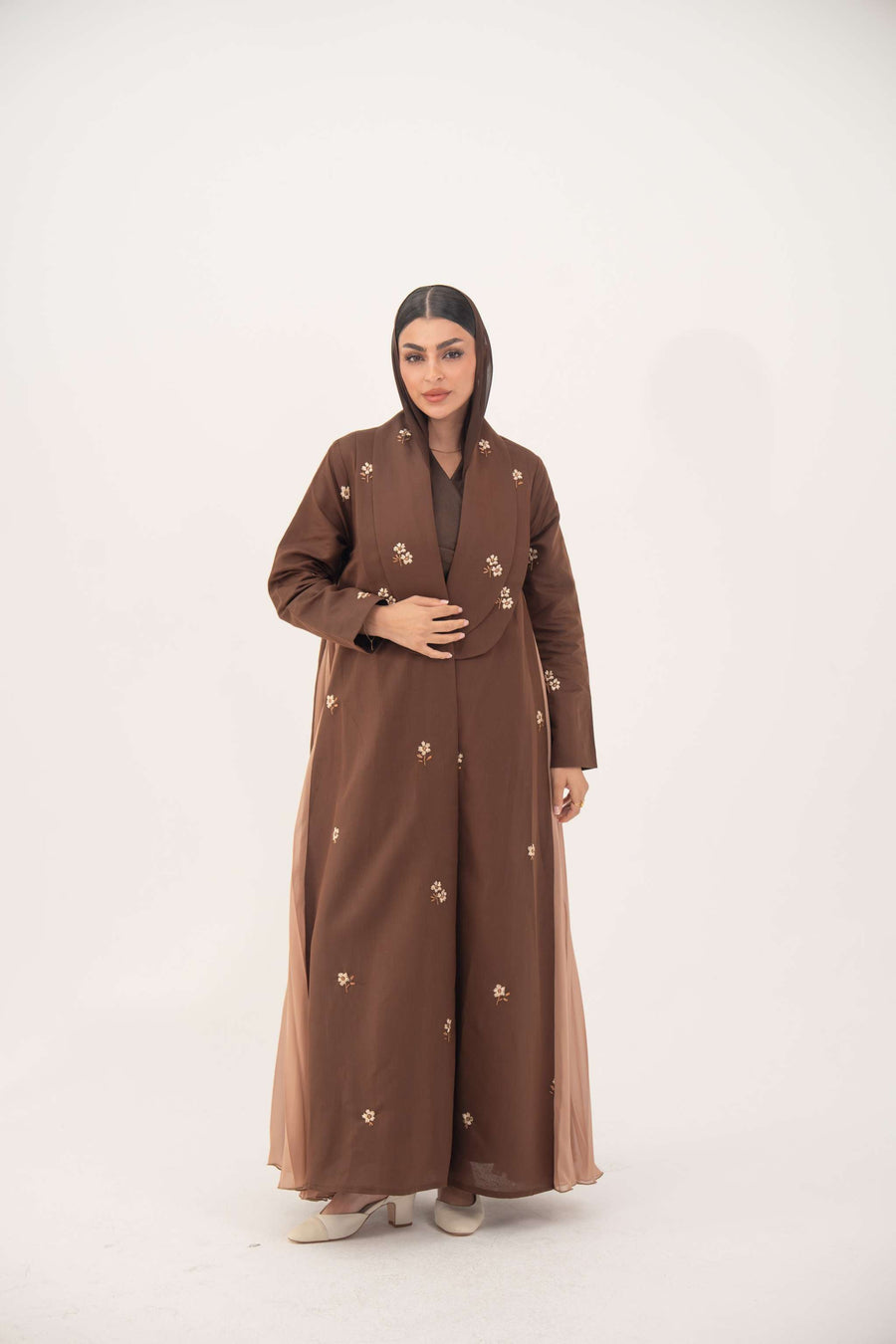 Brown linen blazer abaya with scattered embroidery and pleated chiffon panels modeled by a woman