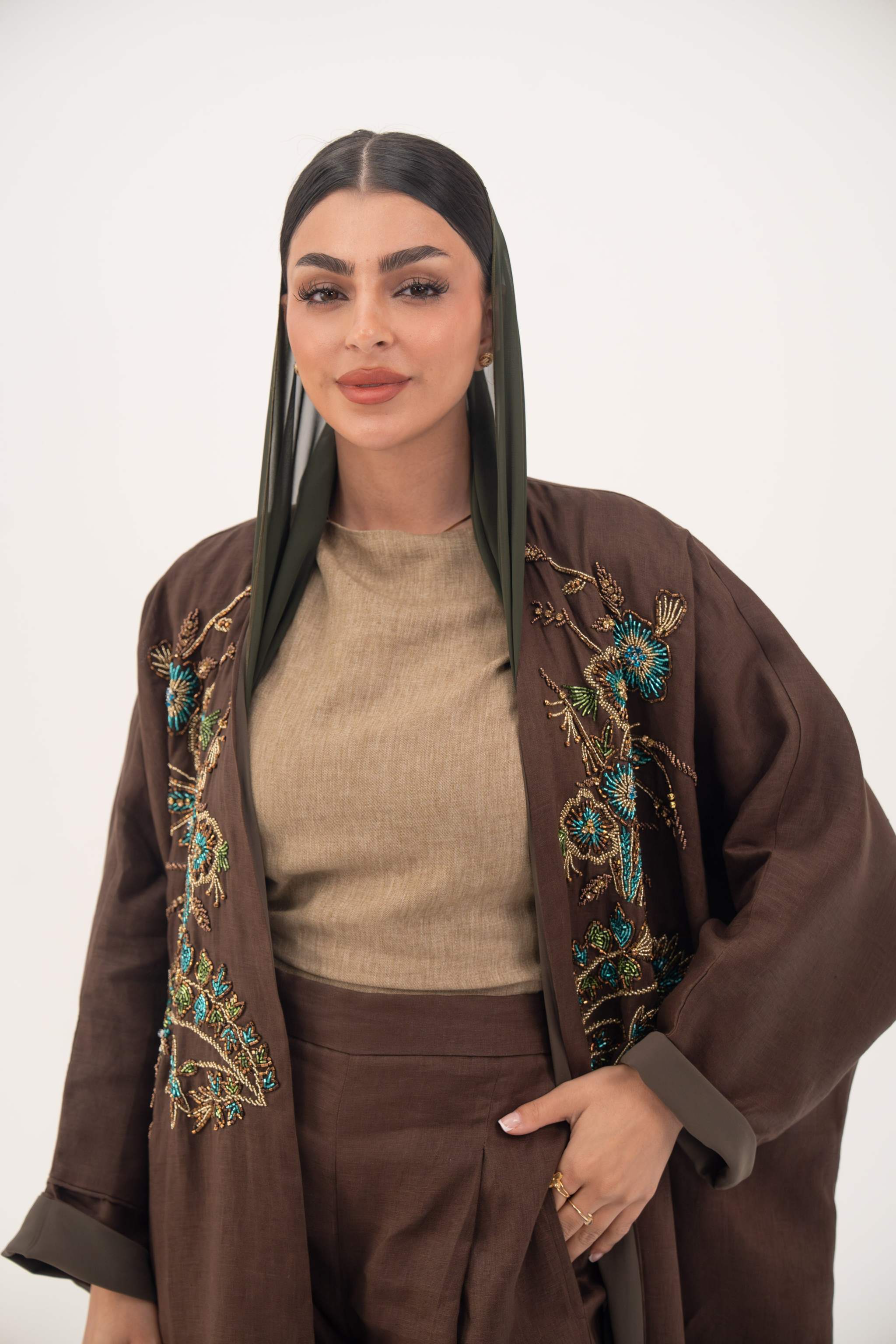 brown bisht abaya with turquoise and gold floral embroidery, lightweight chiffon lining, loose elegant cut for special occasions