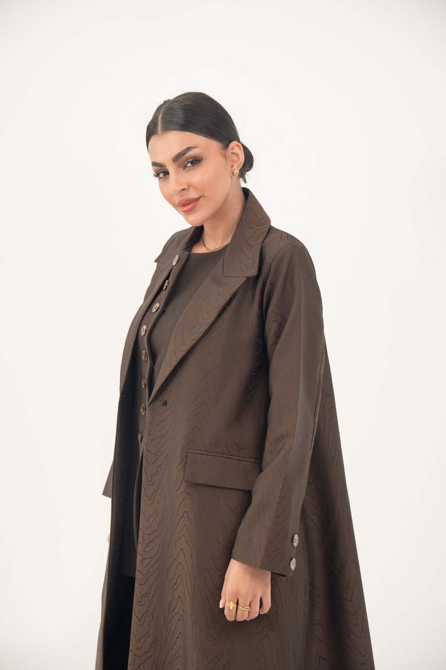 Brown jacquard blazer abaya with sharp lapels, structured tailoring, and elegant textured pattern.