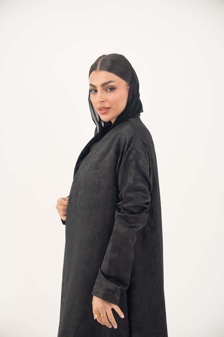 Black Layal blazer abaya with crepe and satin, notched collar, structured shoulders, and satin vest layer for a sleek, modern look.