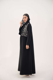 Black Layal blazer abaya with crepe body, satin vest layer, notched collar, and structured shoulders.