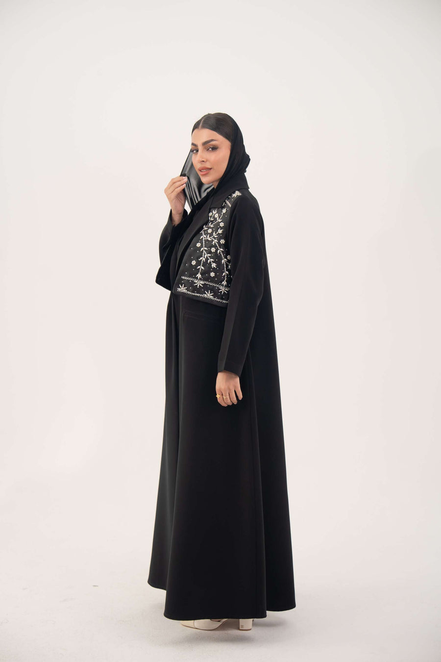Black Layal blazer abaya with crepe body, satin vest layer, notched collar, and structured shoulders.