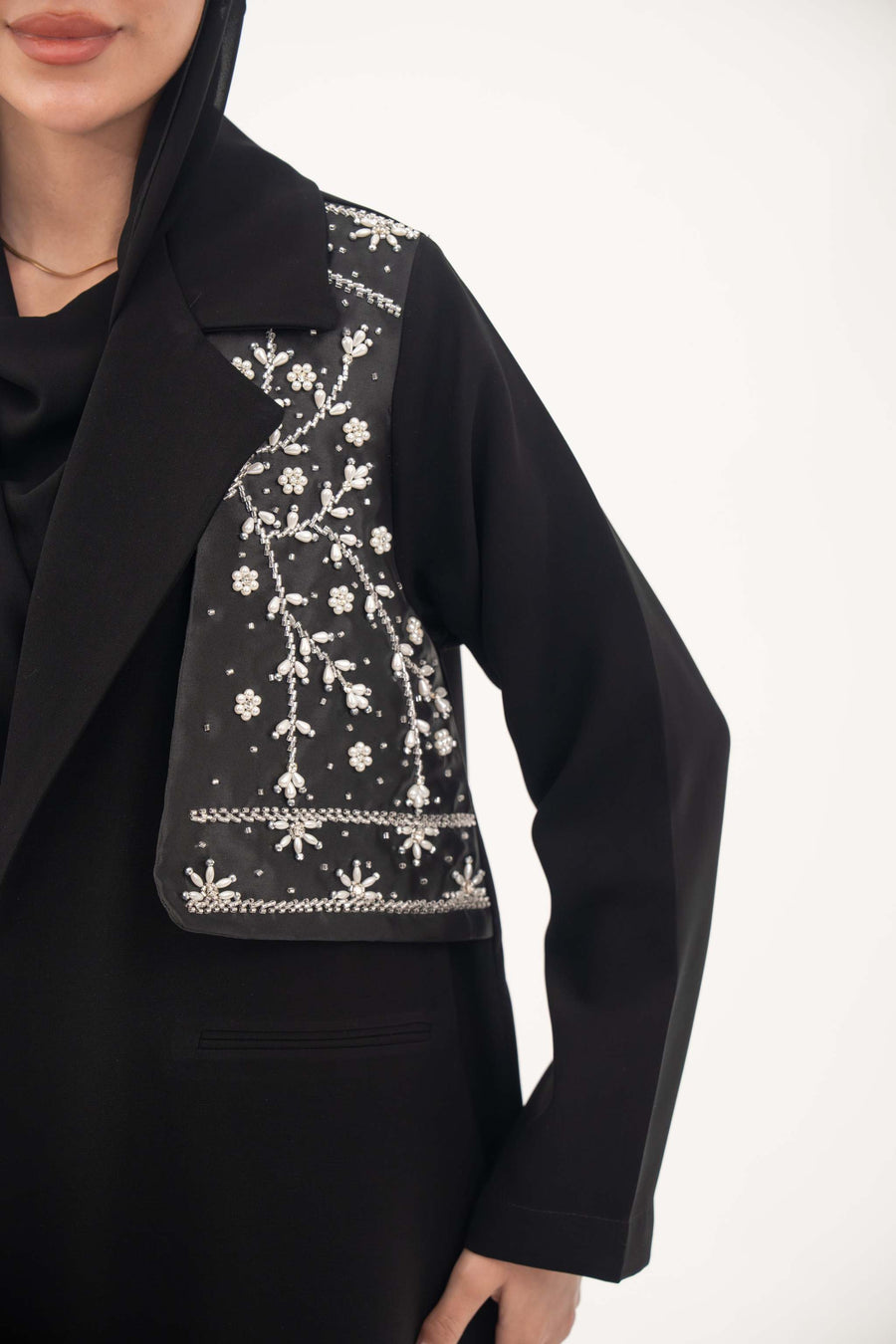 Black Layal blazer abaya with crepe body, satin vest layer, notched collar, and structured shoulders.