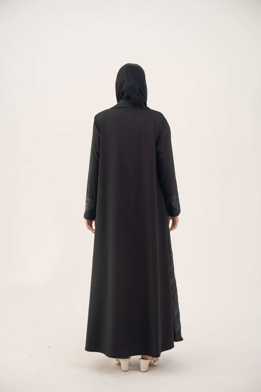 Back view of black jacquard blazer abaya with structured silhouette and classic lapels, perfect for formal occasions.