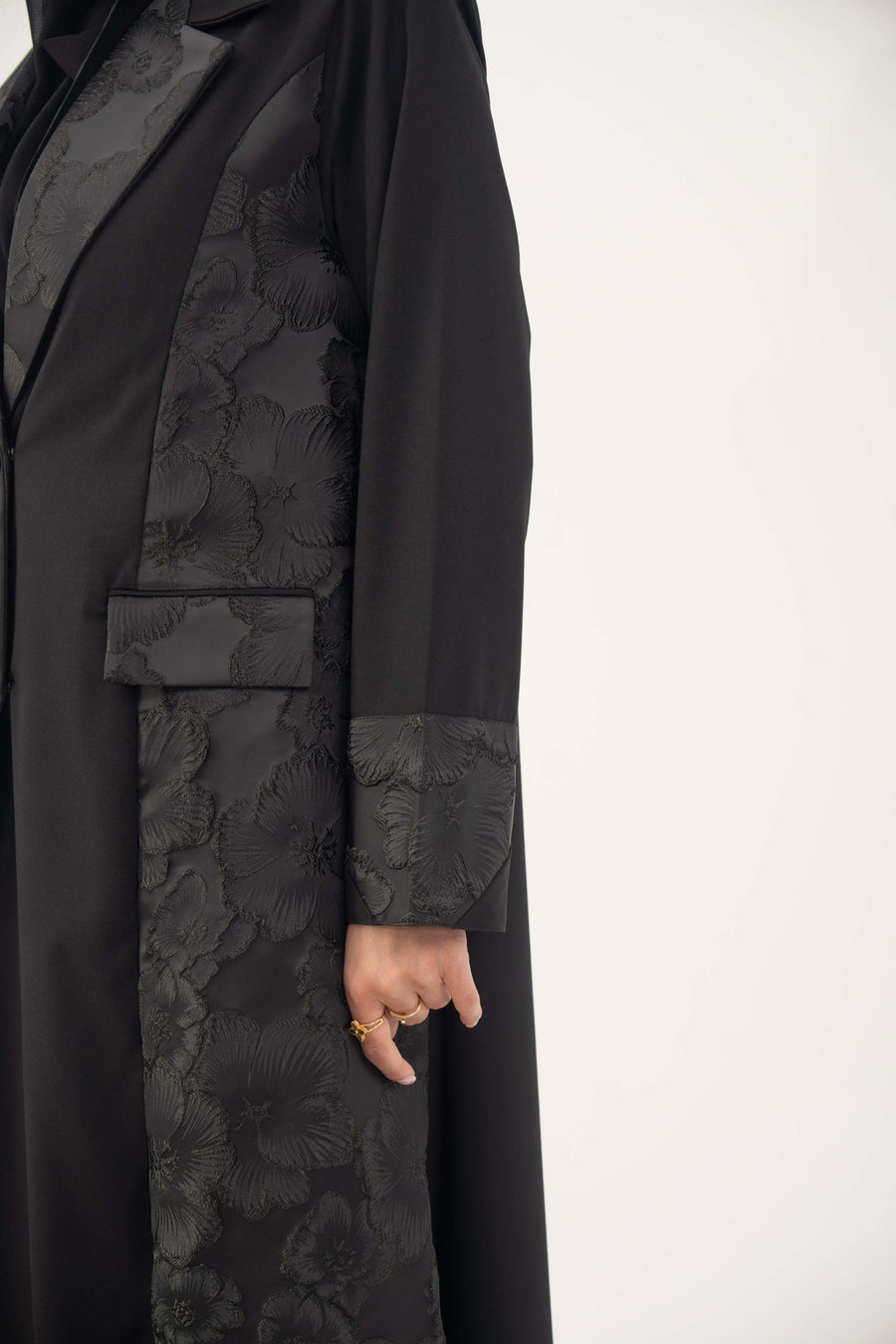 Black jacquard blazer abaya with textured floral pattern and classic lapels for formal wear
