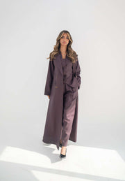 Tailored blazer abaya in soft neutral twill linen blend with structured lapels, statement buttons, and side flap pockets for elegant workwear and formal occasions.