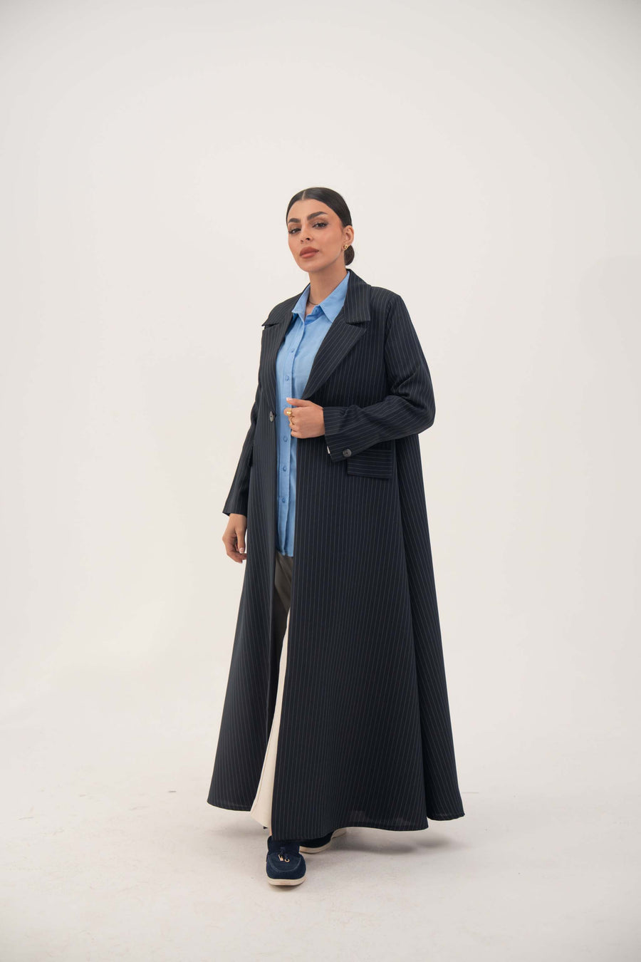 woman wearing Zanira premium navy crepe blend open-front blazer abaya with wide lapel and white pinstripes