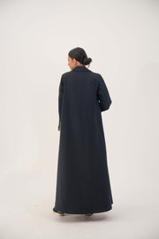 Back view of a deep navy crepe blend open-front abaya with white pinstripes, wide lapel, shoulder pads, and buttoned straight sleeves