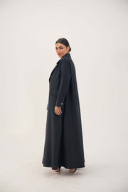 Woman wearing Zanira navy blue crepe blend open-front abaya with fine white pinstripes and buttoned cuffs