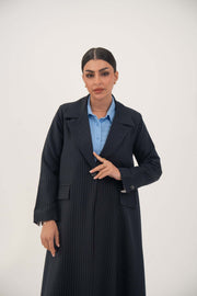 Woman wearing a deep navy open-front blazer with fine white pinstripes made from premium crepe blend fabric
