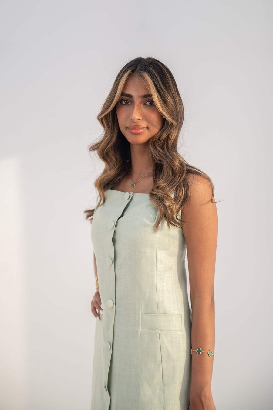 Sleeveless mint green inner dress with full front buttons and straight cut made from lightweight twill linen blend.