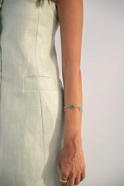 Sleeveless peppermint green inner dress in twill linen blend with front button closure and straight cut design.
