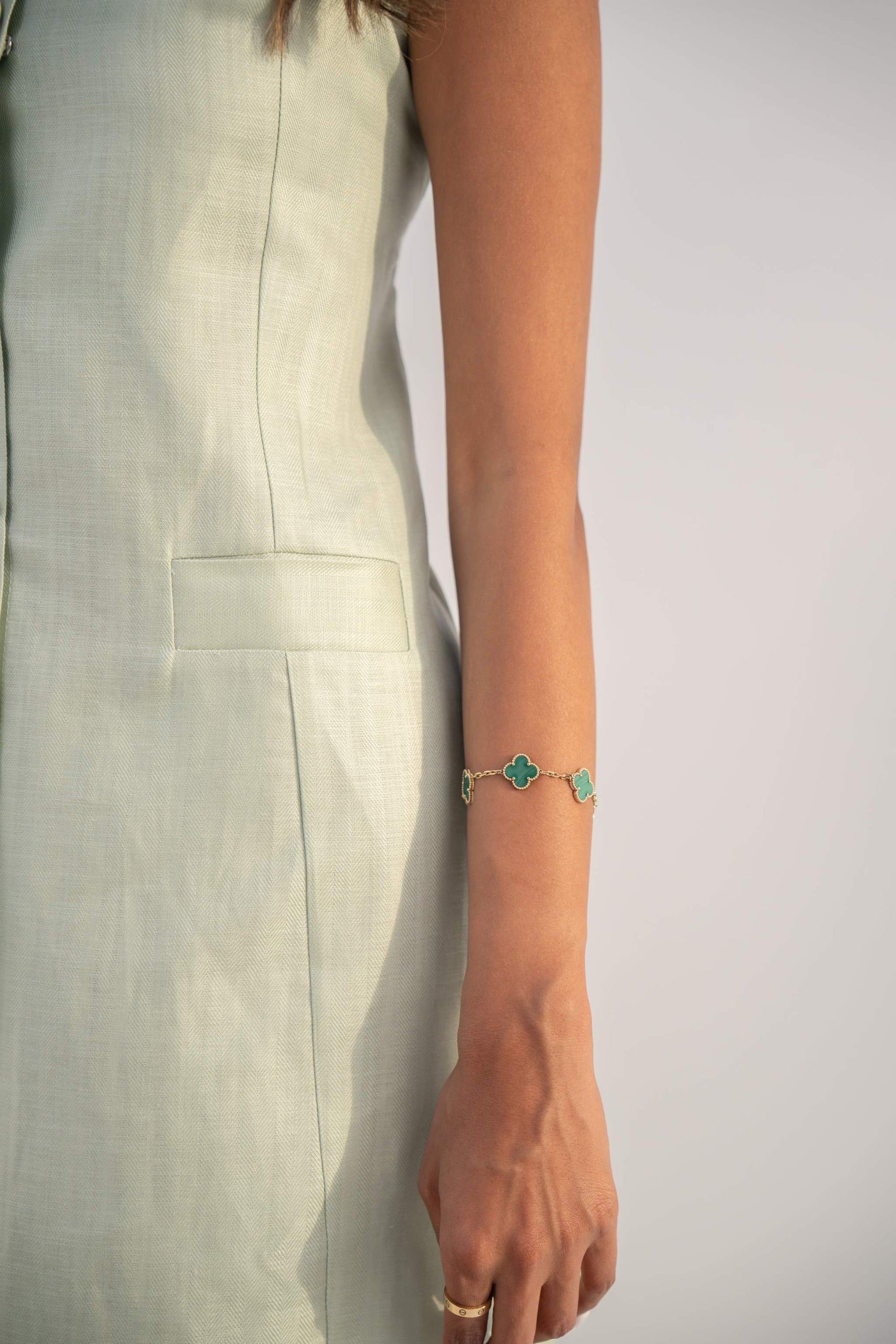 Sleeveless peppermint green inner dress in twill linen blend with front button closure and straight cut design.