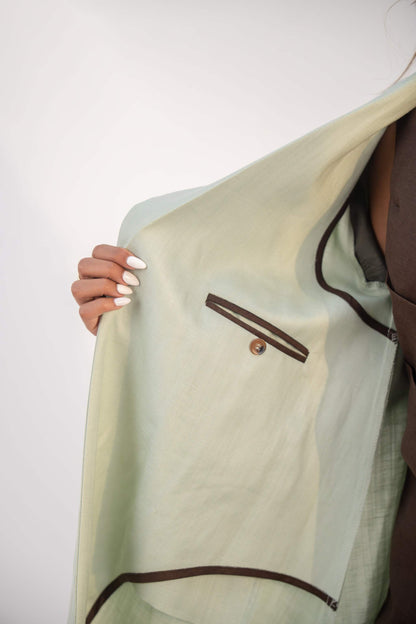 Mint fudge tailored blazer abaya in soft twill linen blend with structured lapels, statement buttons, and practical pockets.