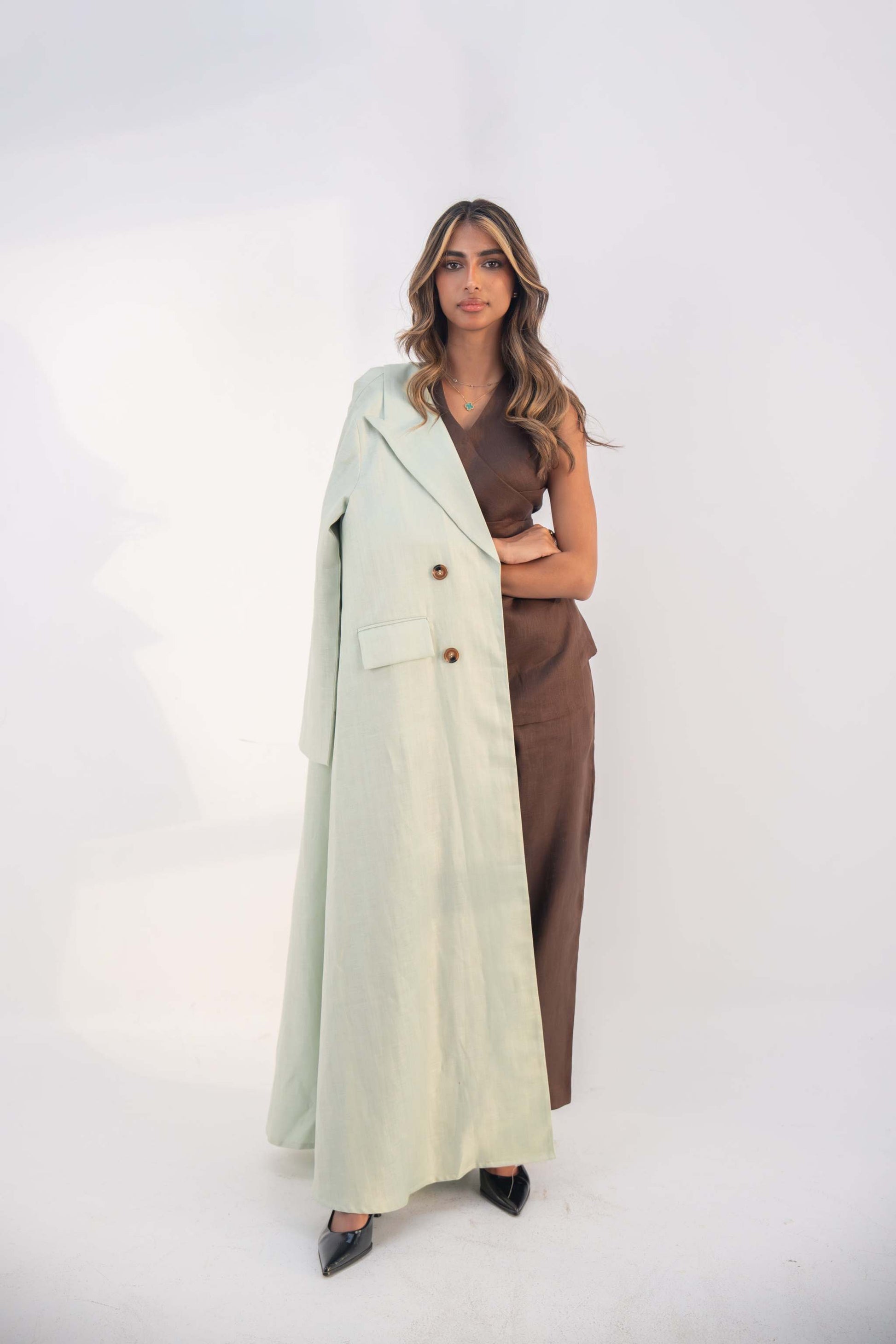 Mint fudge tailored blazer abaya in soft neutral twill linen blend with statement buttons and side flap pockets.