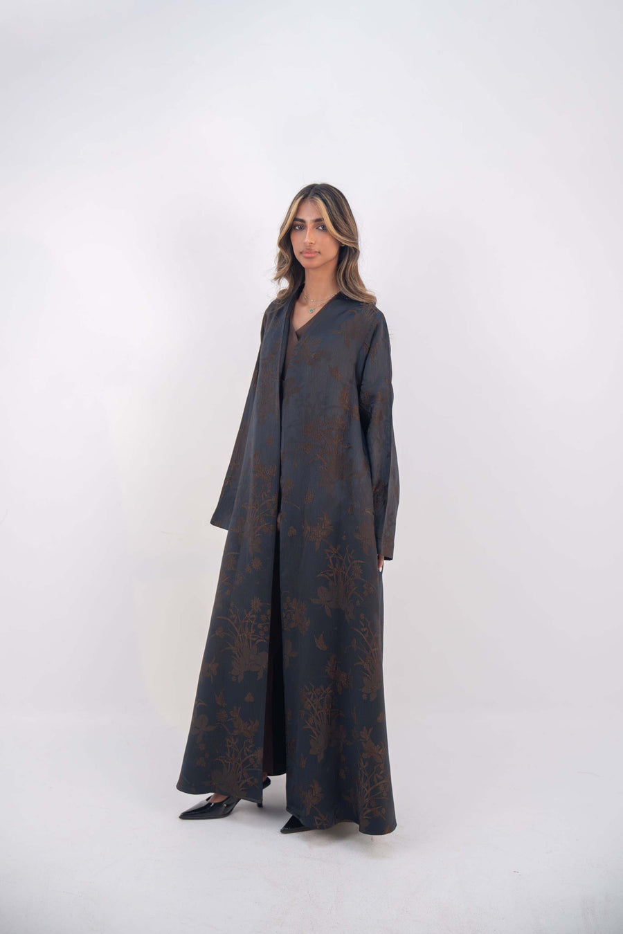 Elegant deep navy jacquard silk abaya with subtle brown floral patterns and wide sleeves