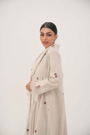 Natural beige linen abaya with burgundy floral embroidery, chiffon pleats, and shawl collar