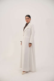 Elegant white linen abaya with grey pinstripes, blazer-inspired cut, single button closure, dark brown inner cuffs, and long flared hem - Elegant abaya