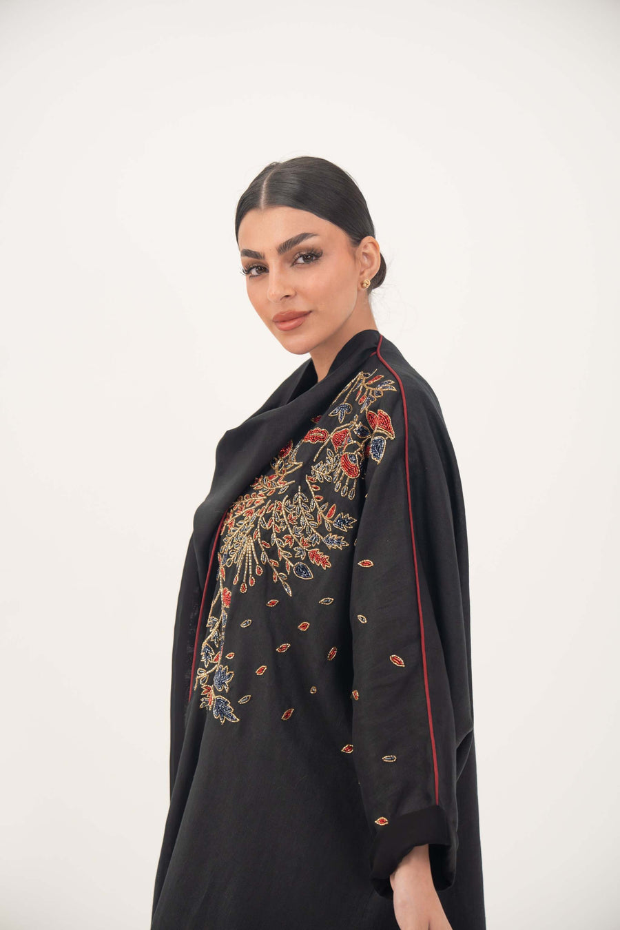Elegant black linen abaya with multicolored red, gold, and navy shak embroidery and red trim detailing - abaya crafted from premium black linen