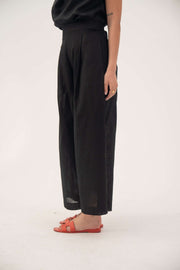 Black linen wide leg pants with relaxed fit and pockets for comfortable, breathable wear