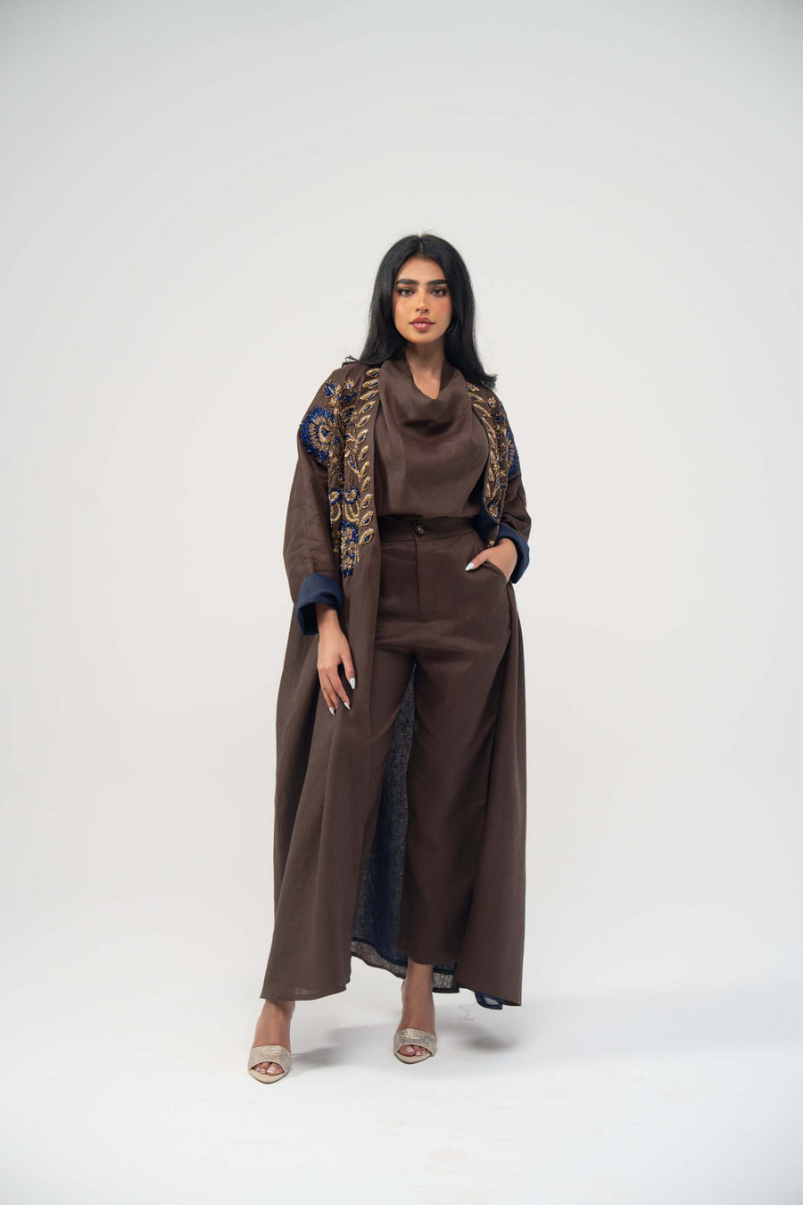 Elegant brown linen bisht abaya with navy chiffon lining and gold embroidery on upper front