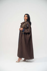 Elegant brown linen bisht abaya with navy blue chiffon lining and gold embroidery on upper front