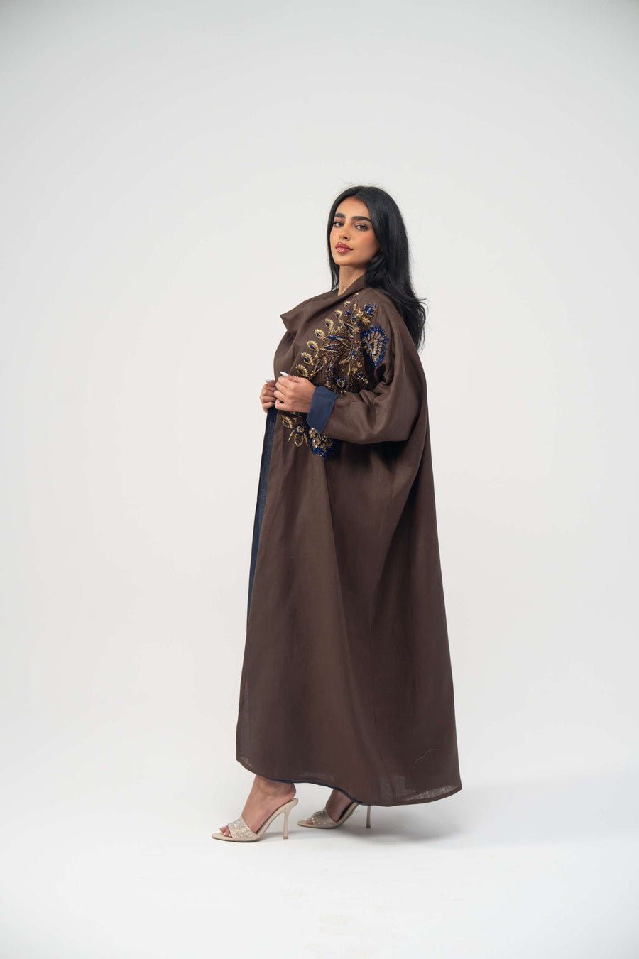 Elegant brown linen bisht abaya with navy blue chiffon lining and gold embroidery on upper front