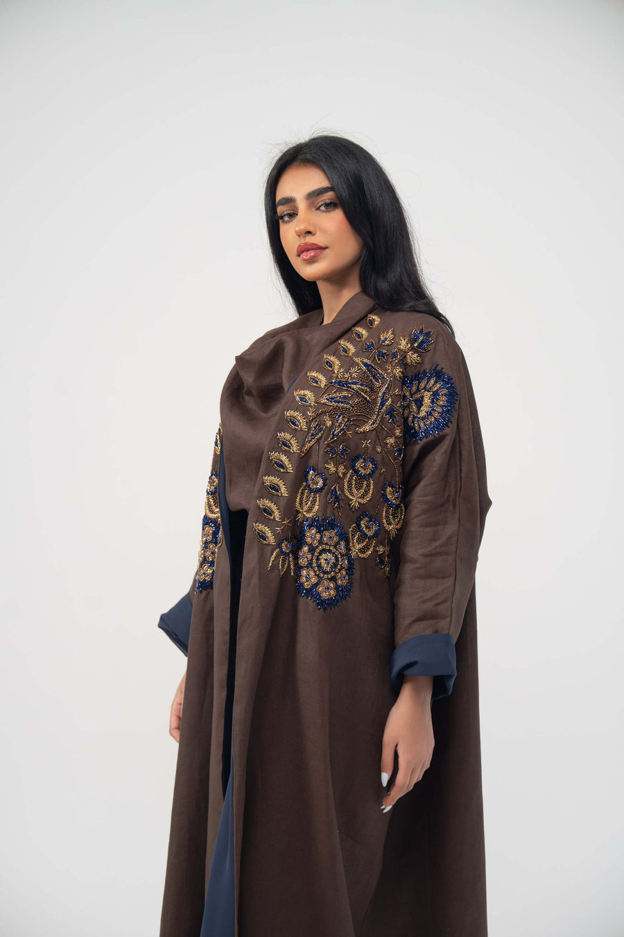 Elegant brown linen bisht abaya with navy chiffon lining and bold navy and gold embroidery on front and cuffs
