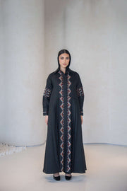 Woman wearing black Full-Length Cotton Abaya with multicolor traditional embroidery on front, sleeves, shoulders, and back.