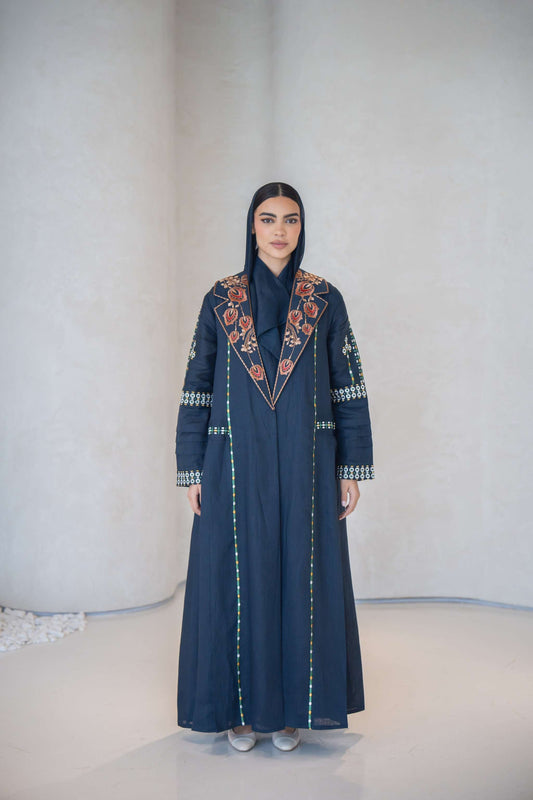 Navy blue breathable lightweight linen abaya with colorful floral hand-embroidery and structured notched lapel collar.