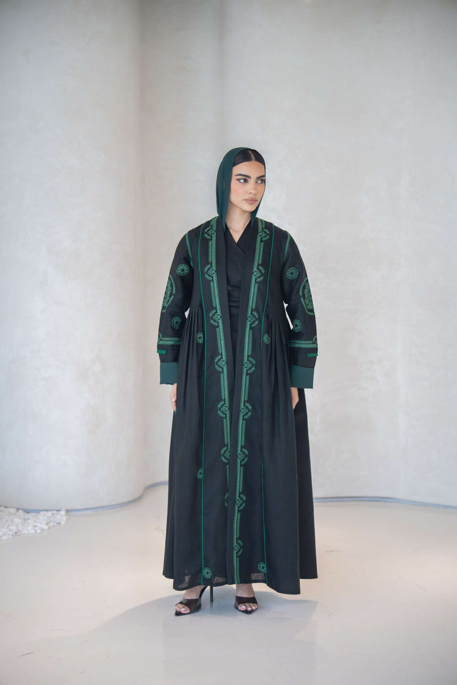 Elegant black abaya with green geometric embroidery and chiffon lining
