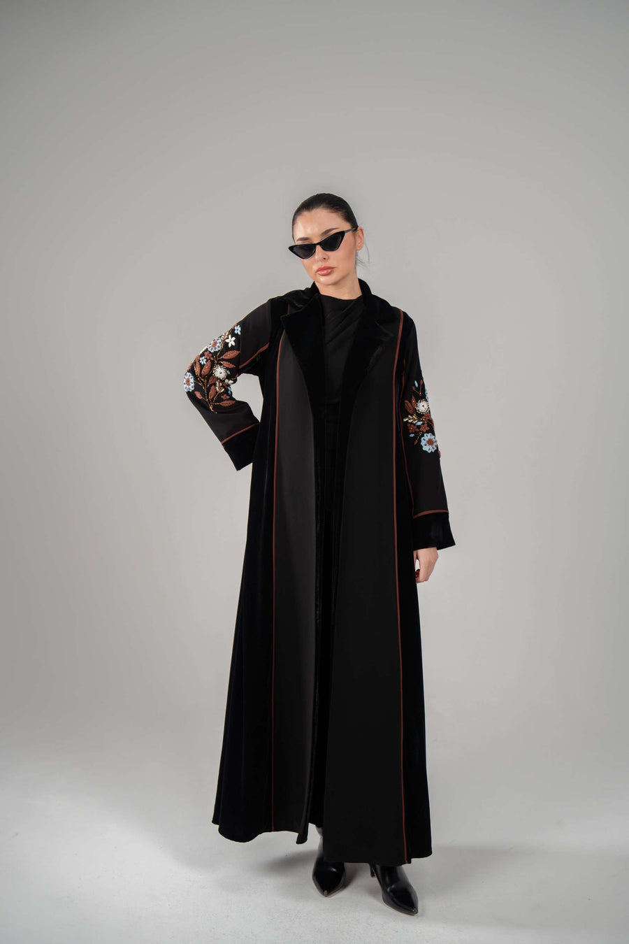 Black Frostine blazer with velvet exterior, crepe panels, and hand-embroidered floral sleeves.