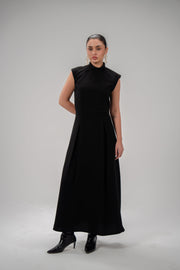 Elegant black crepe dress with pleated sleeves, soft fabric, and modest style for everyday and special occasions.