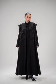 Elegant Empress Abaya in black crepe with intricate hand embroidery and beadwork on bodice and shoulders.