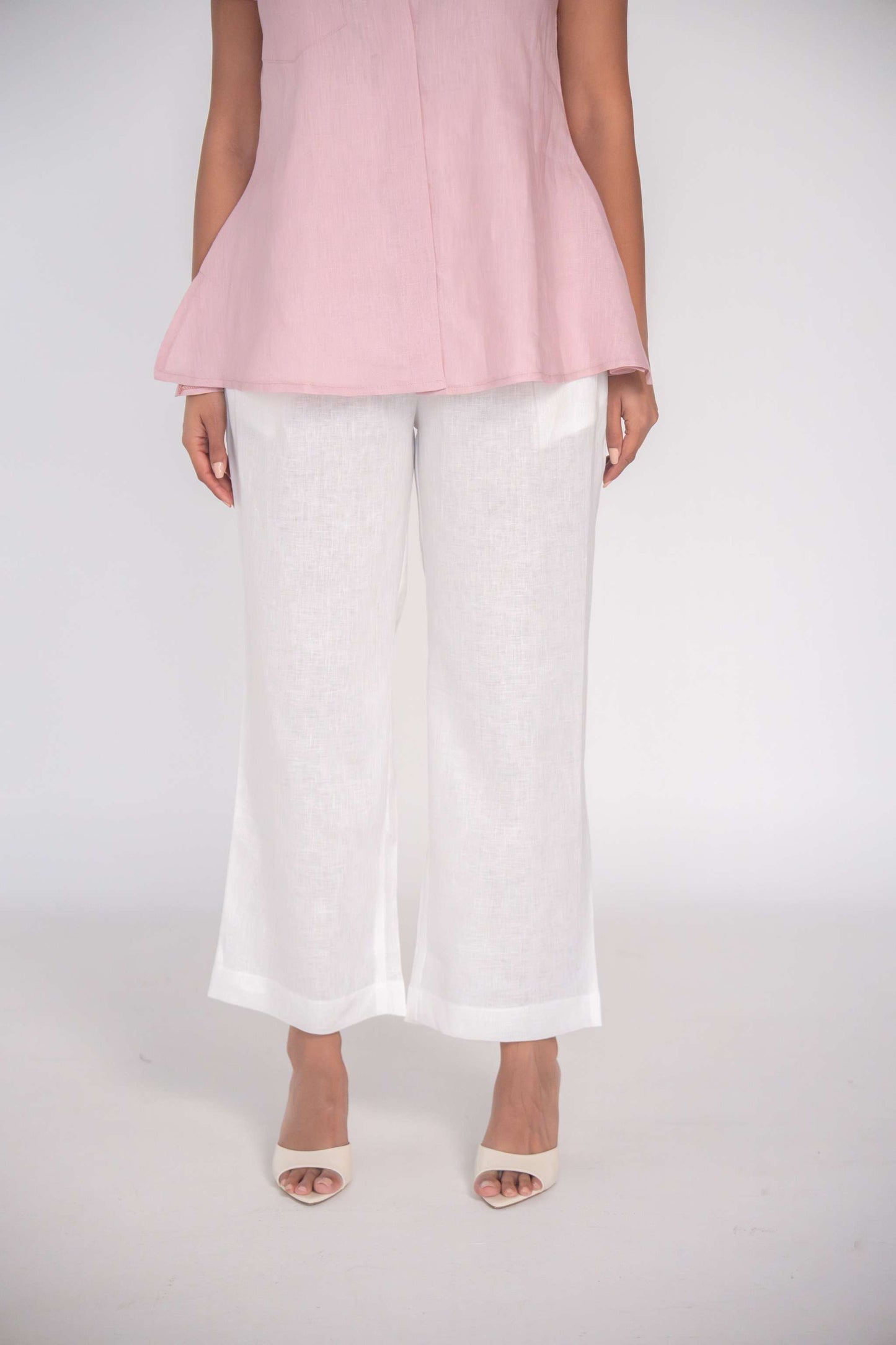 White linen straight cut breathable pants with soft waistband for comfortable warm-weather wear