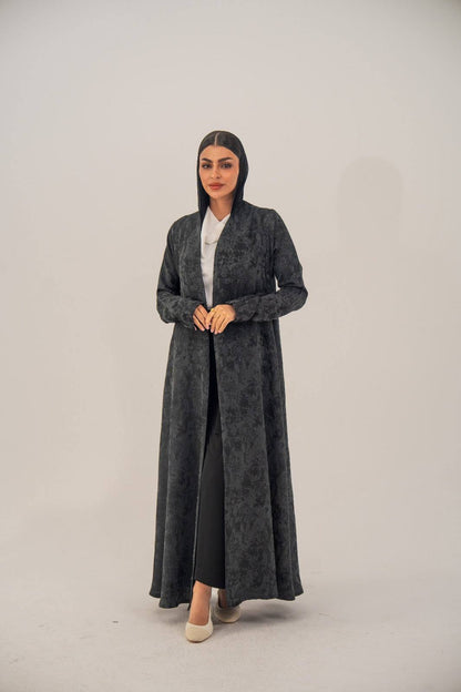 Black silk open-front abaya with subtle abstract pattern and light shimmer, charcoal gray finish.